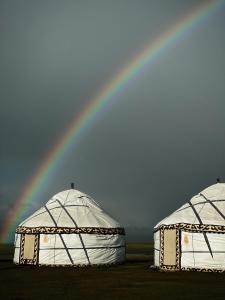 two igloo domes with a rainbow in the background at Ulush Yurts in Naryn