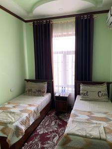 Кровать или кровати в номере Sarbon Hotel Khiva 2