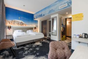 Postel nebo postele na pokoji v ubytování Mercure München am Olympiapark + 37 fotografií