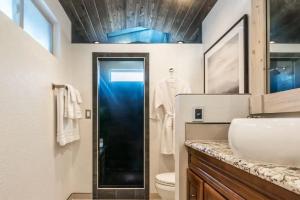 a bathroom with a shower and a sink and a toilet at Cobalt Peak - Pet-Friendly Sauna Panoramic Views in Cascade-Chipita Park