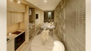 a living room with a couch and a bedroom at 5GreenLuxurieRooms in Turin