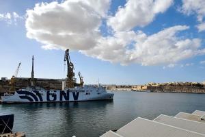 a ferry boat is docked in a harbor at Charming Senglea Studio in Senglea