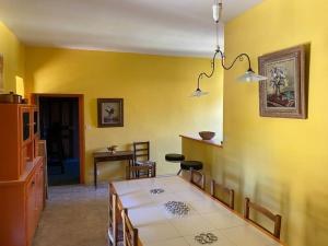 a kitchen and dining room with a table and chairs at Domaine de Linars ☆ La Forge ☆ in Le Truel +24 photos