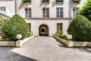 Vonkajšia záhrada v ubytovaní Modern & colourful 3BD for 9 guests in Le Marais!