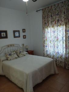 Ein Bett oder Betten in einem Zimmer der Unterkunft Casa Tita Carmen