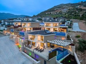 an aerial view of a house with a swimming pool at Tashan Villas in Kas