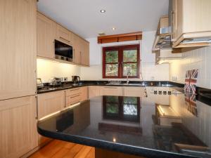 a kitchen with a large island in the middle at Lodge 22 Cherry in Wadebridge
