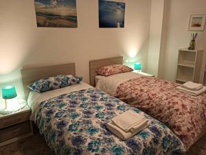 Postel nebo postele na pokoji v ubytování Don Alfonso Apartaments