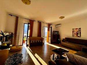 a living room with a couch and a table at KOALA 3 in Trstenik