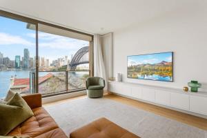 a living room with a view of the sydney harbour at Boutique 2-Bed with Stunning Sydney Harbour Views in Sydney
