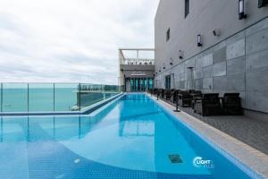 a swimming pool on the side of a building at Elbon The Stay in Busan