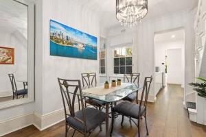 a dining room with a table and chairs at Traditional 2-Bed Terrace House in Millers Point in Sydney