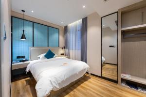 Postelja oz. postelje v sobi nastanitve Warm Yes Business Hotel -Free shuttle bus during the Canton Fair
