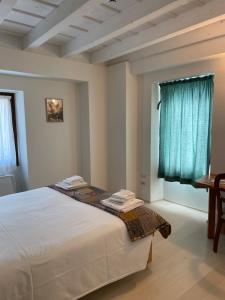 Cascina Bagaggera客房内的一张或多张床位