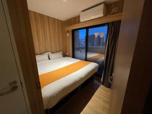 Postel nebo postele na pokoji v ubytování Popway Residence Tennoji + 23 fotografií
