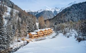 a house in the middle of a snowy mountain at Chalet Stuibenfall Niederthai in Umhausen