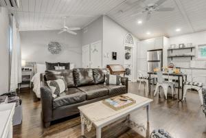 a living room with a couch and a table at Golden Grotto - Studio King BBQ Fire Pit in Colorado Springs