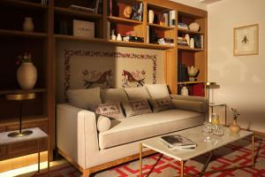 a living room with a couch and a table at Eunice Hotel Gastronómico in Salamanca