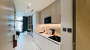 a kitchen with a sink and a counter top at Modern Studio- 115 Westwood Al furjan in Dubai