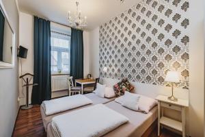 Voodi või voodid majutusasutuse Grand Tábor toas