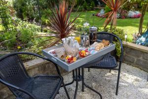 a tray of food sitting on a table in a garden at Highgate House in Whitby