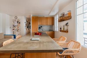 a kitchen with a large island in a room at Paris Trocadero Elegant Residence in Paris