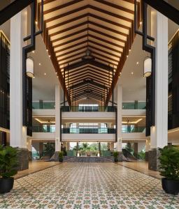 an empty lobby of a building with a wooden ceiling at PARKROYAL A'FAMOSA MELAKA RESORT in Melaka