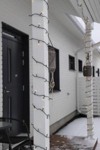 a pole with lights on it in a room at Big apartment, near Santaclaus Village in Rovaniemi