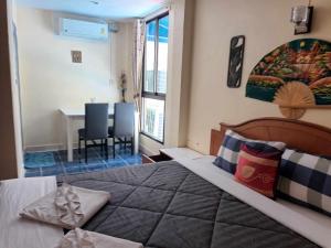 Ένα ή περισσότερα κρεβάτια σε δωμάτιο στο Patong Rose Guest House 50m to Beach