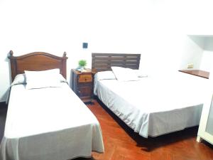 Posteľ alebo postele v izbe v ubytovaní Hostal Cuzco
