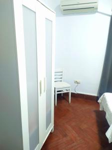 Posteľ alebo postele v izbe v ubytovaní Hostal Cuzco