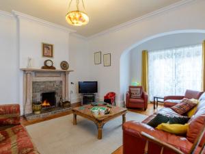 a living room with a couch and a fireplace at 6 Bed in Richmond 6mls 52779 in Catterick Bridge