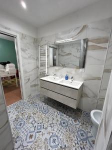 a bathroom with a sink and a mirror at San Peter Vale House in Rome
