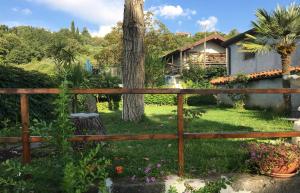 a wooden fence in front of a house at 13 Via Pavone in Zafferana Etnea
