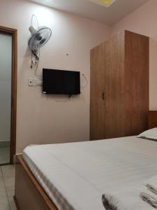 Postel nebo postele na pokoji v ubytování MOTEL WIN PHÁT + 2 fotografie