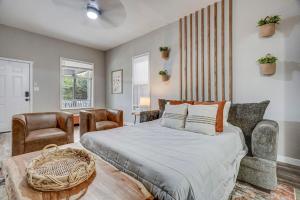 a bedroom with a bed and a table and chairs at Pikes Peak Pool Hall - Near Top Spots BBQ Fire Pit in Colorado Springs