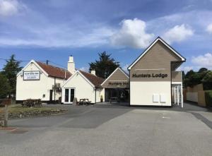 a building with a sign that reads hunters lodge at Hunters Lodge in Barnstaple