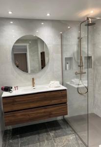 a bathroom with a sink and a mirror at Appartement Rue Grimaldi in Nice