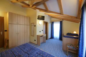 Postel nebo postele na pokoji v ubytování Berg Hotel Latemar Spitze