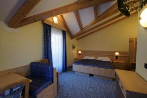 Postel nebo postele na pokoji v ubytování Berg Hotel Latemar Spitze