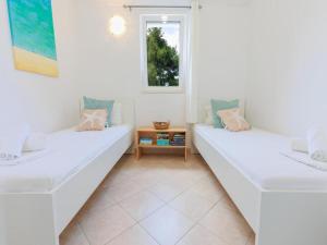 Postel nebo postele na pokoji v ubytování Lumbarda Resort Apartments