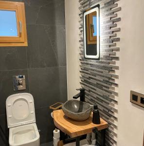 a bathroom with a sink and a toilet at Chalet Cristal II in Les Contamines-Montjoie