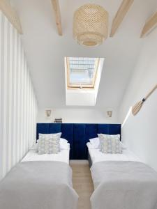 Кровать или кровати в номере Domki Balticana