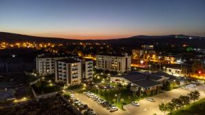 an aerial view of a city at night at Aforia Thermal Residences in Afyon