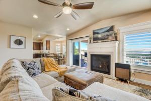 a living room with a couch and a fireplace at Stargazer Paradise - Top Spot Hot Tub Gym Man Cave in Monument