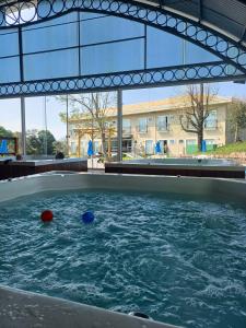 a pool of water with two balls in it at Maestro Thermas Park Hotel in Francisco Beltrão +22 photos