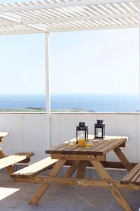 a picnic table on the roof of a house at Two bedrooms apartment close to airport in Carrizal +49 photos