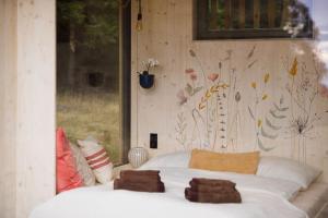 Postel nebo postele na pokoji v ubytování Tiny House Manka
