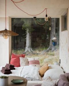Postel nebo postele na pokoji v ubytování Tiny House Manka
