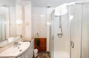 a bathroom with a sink and a shower at Warm&Welcoming City Centre Apartments by Meadows 3 in Edinburgh